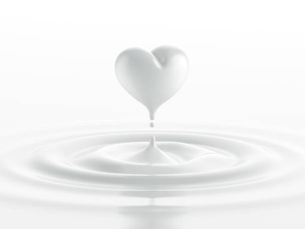 drop of milk in form of heart - milk white imagens e fotografias de stock