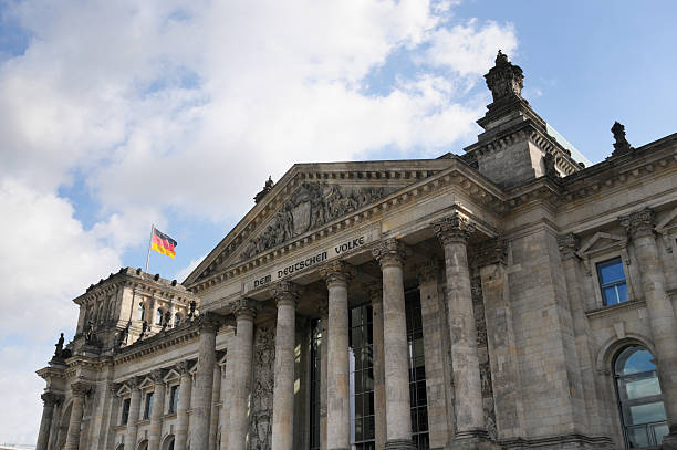 istock German flagg in front of The Reichstag Berlin 135091759