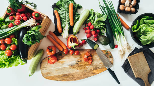 istock Healthy Eating: Top view of White Kitchen Table Full with Fresh Organic Vegetables 1350918356