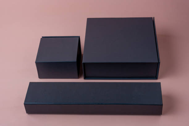 istock Boxing Day dark gray boxes on beige background 1350919124