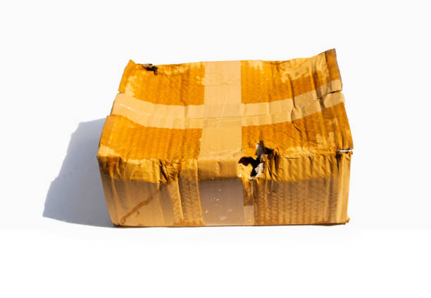 istock Damaged cardboard box with hole, Broken and wet product packaging 1350920861