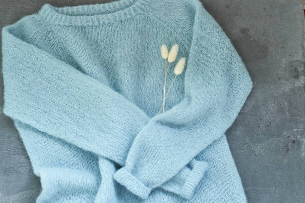 istock Blue knitted sweater handmade isolated gray backround 1350922090