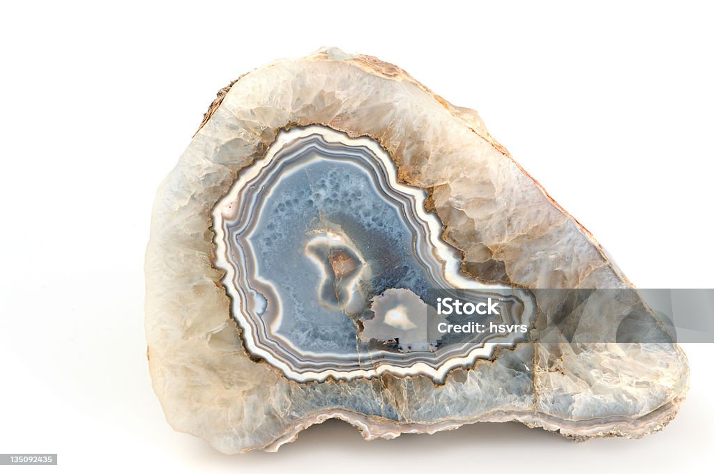 blue banded agate on white background blue banded agate on white background. inside with small quartz crystals Agate Stock Photo