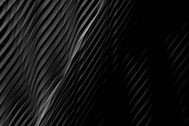 istock Digitally rendered wavy dark gray texture resembling wall surface. Grunge abstract black and white background on the subject of modern interior, architecture or technology. 1350926135