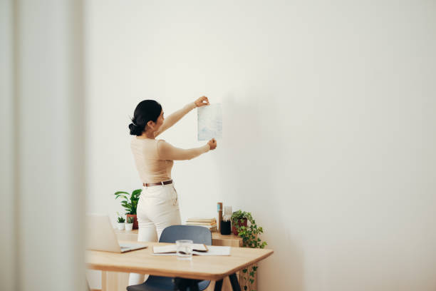 istock Business Woman Analyzing Document at Home 1350926634