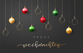 istock Christmas greeting card with ornaments and text in German 1350929205