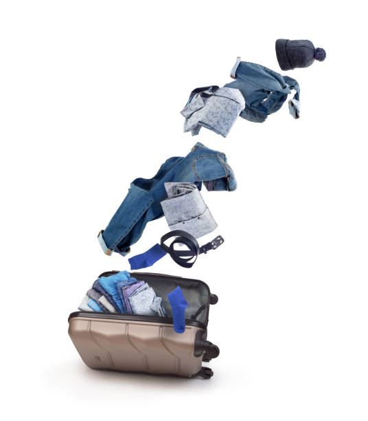 istock Men's things fly out of a suitcase against a white background 1350930883