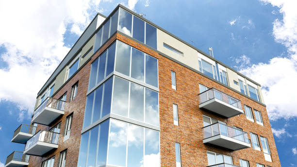 istock Modern residential building on a sunny day with a blue sky. 3d illustration 1350931012