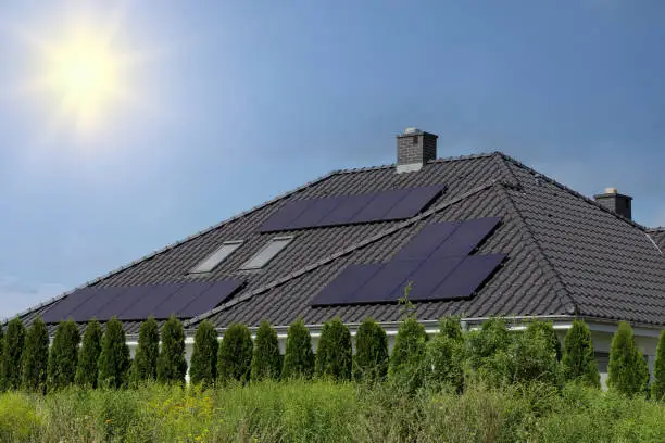 Big house with solar panels on the roof.
