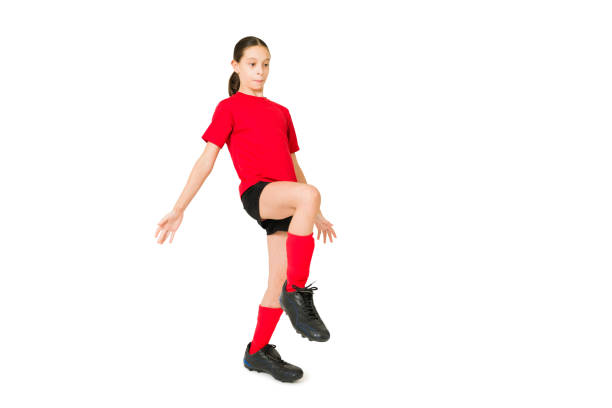 istock Young girl controlling a soccer ball 1350932298