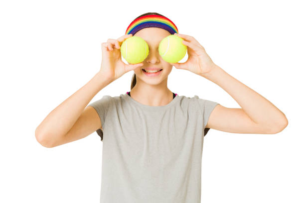 istock Young girl having fun during a tennis game 1350932866