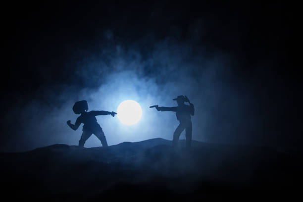 istock Western cowboy silhouette with texture at sunset and slivers of light 1350936203