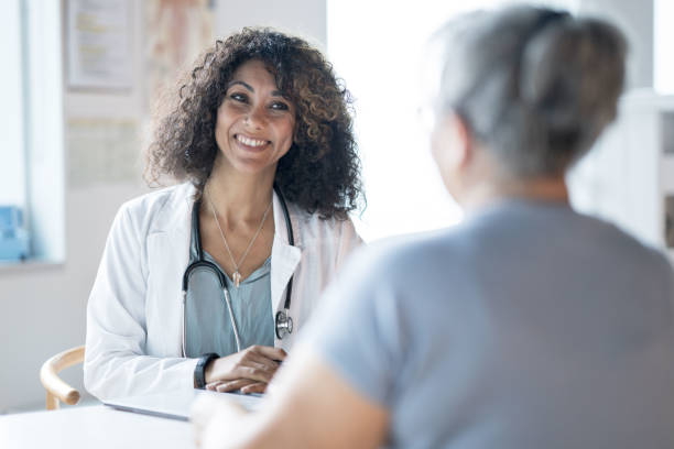 istock Doctor Talking with a Patient 1350942339
