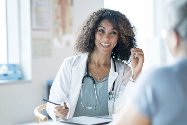 istock Doctor Talking with a Patient 1350942341