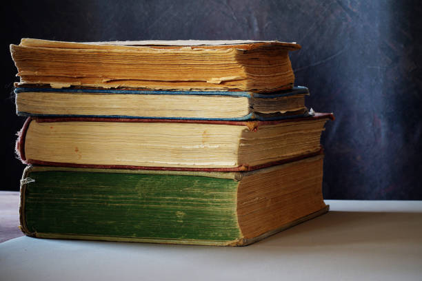 istock A stack of old books in different colors. 1350942579