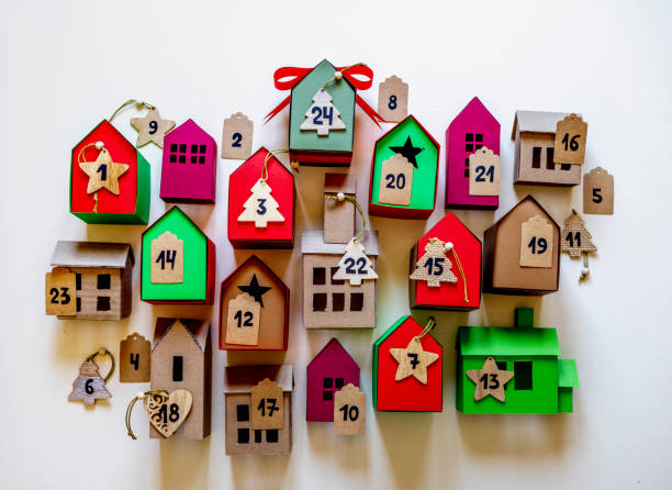 istock Advent calendar diy. Flat lay. Waiting for Christmas. House shaped boxes. 1350943565