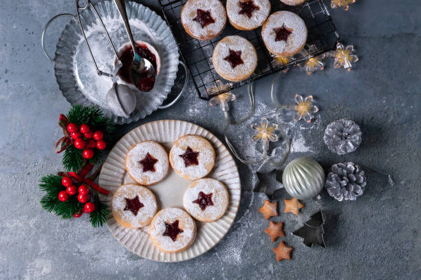 istock Linzer Christmas cookies filled with raspberry jam on concrete background 1350943837