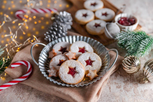 istock Linzer Christmas cookies filled with raspberry jam on concrete background 1350943841