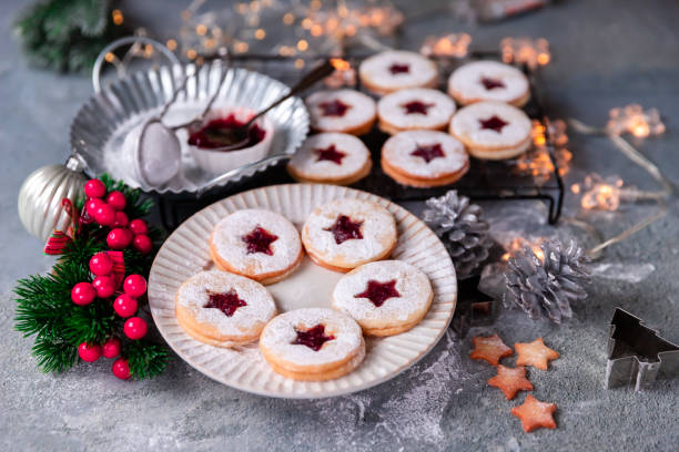 istock Linzer Christmas cookies filled with raspberry jam on concrete background 1350943863