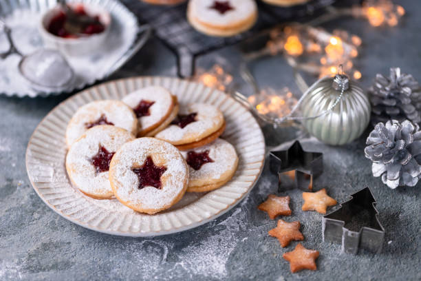 istock Linzer Christmas cookies filled with raspberry jam on concrete background 1350943872