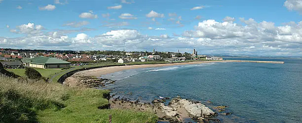 A panoramic view of St. Andrews bay scotland looking towards the Abbey and harbour.