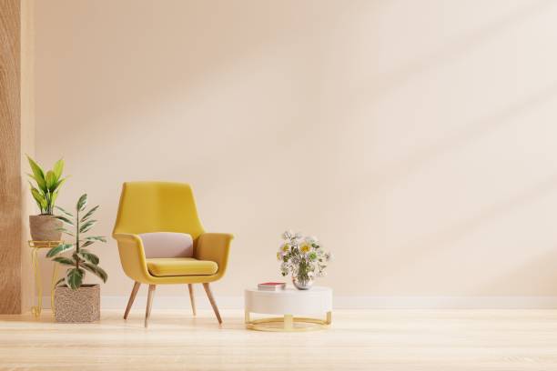 istock Modern minimalist interior with an armchair on empty cream color wall background. 1350949693