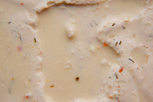 detail shot of low fact cheese cream in a container on table,