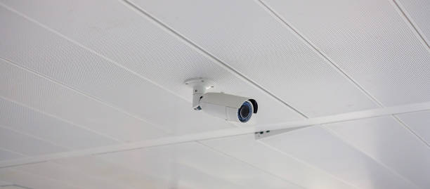 Modern Security Camera with office or house background, cctv to record and property protection for car park