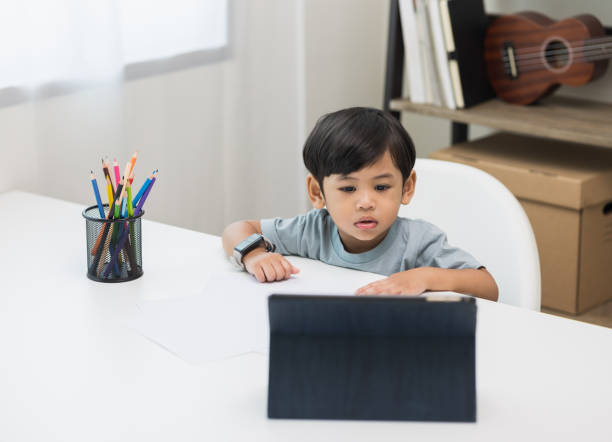 istock Asian little boy education from home. Developing children's learning before entering kindergarten Practice the skills of drawing and painting. 1350961301