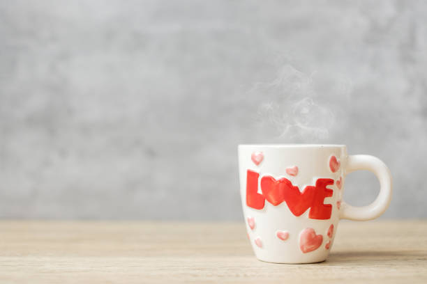istock coffee mug on wood table background in the morning, Blank copy space for text. International coffee day, happy Valentine day and daily routine concept 1350963077