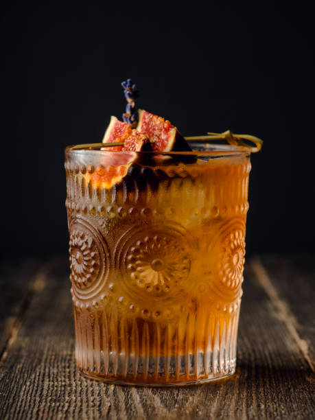 istock Autumn styled old fashioned cocktail with figs, honey and lavender. Selective focus. Shallow depth of field. 1350966437