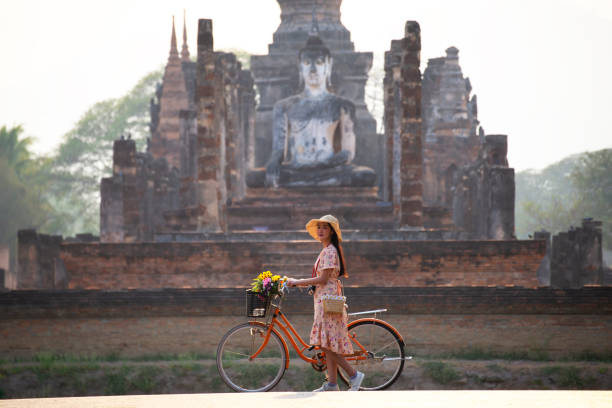 istock Asian tourists is visiting at Sukhothai in Thailand. 1350968028