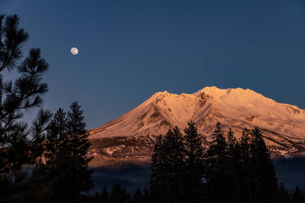 istock Full moon rising over Mt. Shasta 1350968199