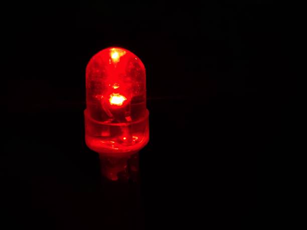 istock Macro close up a red led light with isolated in black background 1350970770