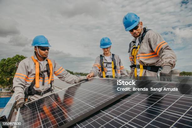 Working On Installing Solar Panels Stock Photo - Download Image Now - Solar Panel, Installing, Solar Energy