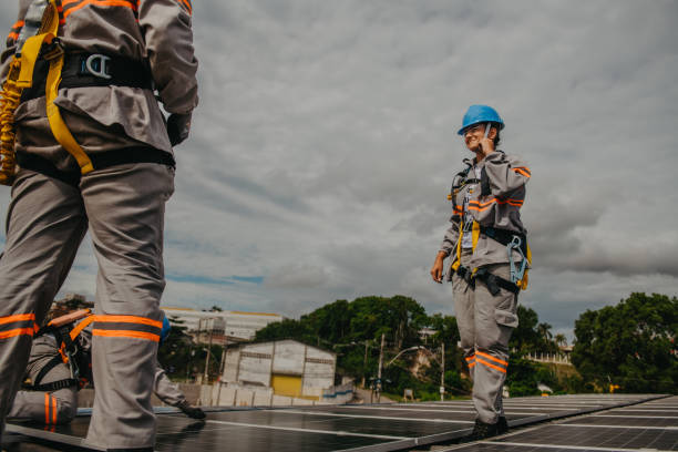 istock woman on the roof working on installing solar panels 1350971577