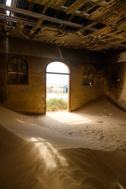 istock Light streaming through open door in Kolmanskop ghost town 1350971601
