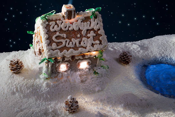 istock Small gingerbread cottage in the lake at winter 135097828