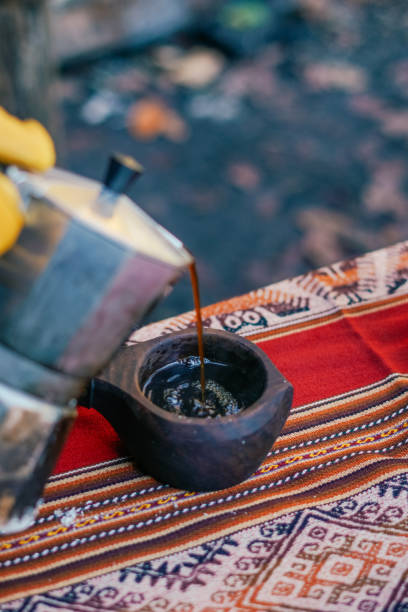 istock Unrecognizable Man Pouring Coffee from a Moka Pot Outdoor 1350984854