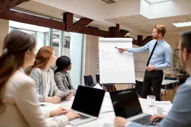 istock Businessman presenting new project to partners in the office 1350987841