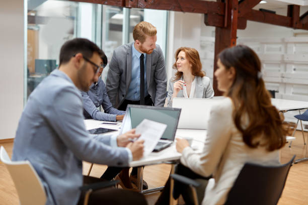 istock Business partners discussing documents and ideas during business meeting 1350987915
