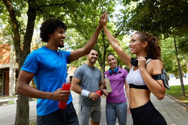 istock Couple giving each other high five after hard training 1350988030