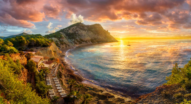 Landscape with Sol d'en Serra beach, Ibiza Landscape with Sol d'en Serra beach at sunrise time, Ibiza islands, Spain ibiza island stock pictures, royalty-free photos & images