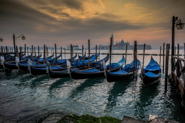 istock Gondolas on the jetty in San Marco square in Venice 1350993606