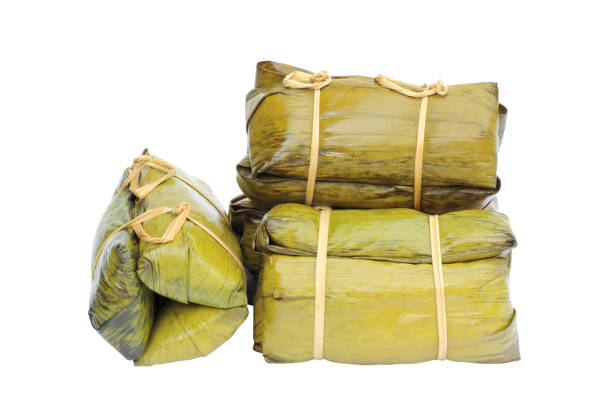 istock Thai Dessert, ( Ka Nhom Tian ) Glutinous rice steamed with coconut on white background 1350996547
