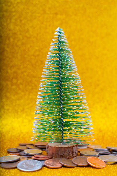 istock Christmas tree and Metallic American cents. 1350996640
