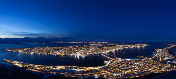 Panorama of Tromsø city A beautiful view of the city of Tromsø can be seen from its own local mountain, Fjellheisen, which lies at over 400m.a.s.l.. finnmark stock pictures, royalty-free photos & images