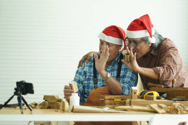 istock Two senior men waved greetings via video call. 1350997939