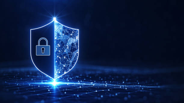 istock Data protection is a concept in cybersecurity and privacy technologies. There is a shield on the left side. The small padlock serves as the connection point between the polygons. dark blue background. 1351000437