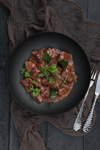 istock Homemade Goulash beef stew plate served in rustic kitchen 1351002514